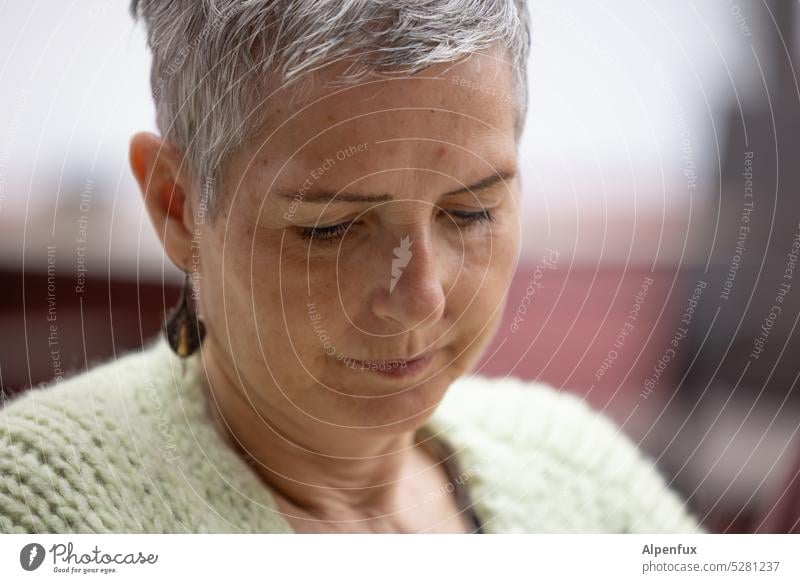 MainFux | thoughtful woman Woman Meditative feminine Feminine Looking Thinking portrait Short-haired Downward earring Skeptical grey hair short hair