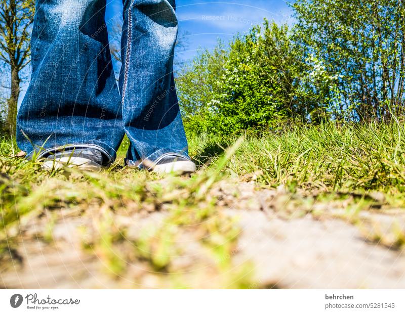 keep both feet on the ground Legs Human being Woman Jeans Flares Sneakers sneakers Lanes & trails Field from below Worm's-eye view Grass blades of grass
