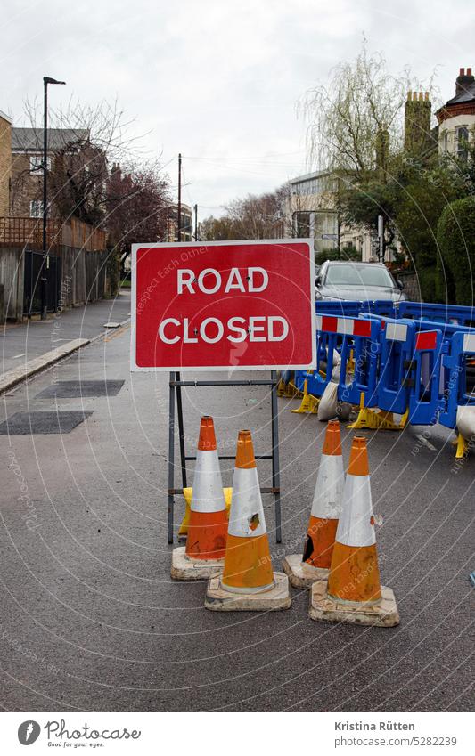 ROAD CLOSED Road closed Barred Closed Street sign Pylons guiding cone Construction site Roadworks Traffic lane Road traffic Transport obstruction of traffic
