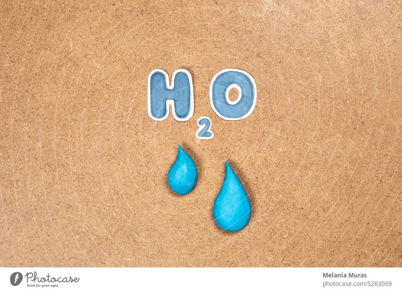 Water drop and H2O symbol, concept of clean water and global care of resources. Environmental topics, hydroelectric energy, drink water resources. abstract