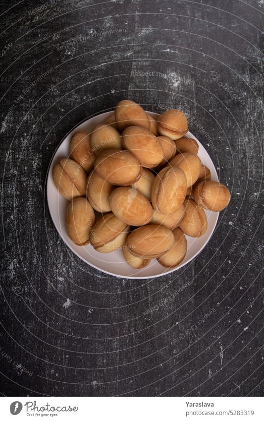 photo of cookies with boiled condensed milk in the form of peanuts nuts condensed milk ready menu pastry dessert sweet filled tasty ball rustic ingredient