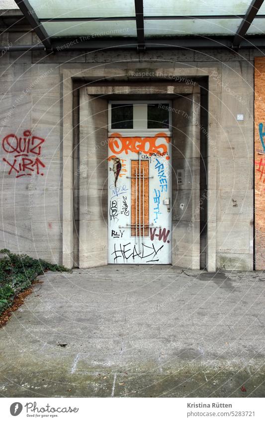 graffiti door Entrance Portal Graffiti Tags forsake sb./sth. Closed urban street art paste up Building Architecture Canopy