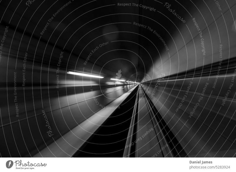 Tunnel warp in black and white, or rays emanating from a distant point. Long exposure Black & white photo Abstract Perspective Light Speed Transport Movement