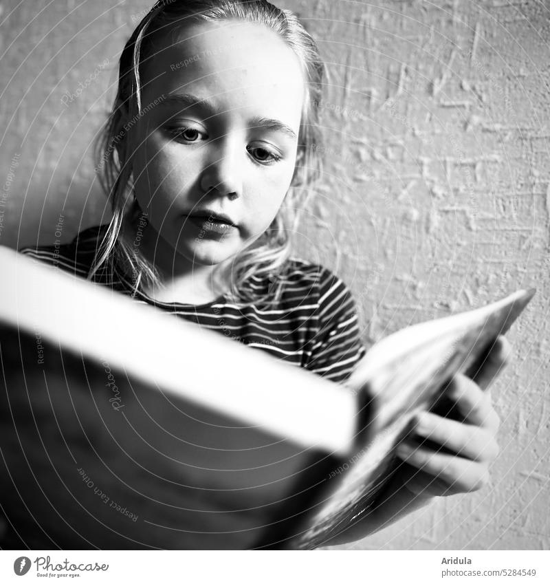Portrait | child reading a book b/w Child Reading Book Face eyes hands Looking concentrated Concentrate thrilling Tension Education Study Literature hollowed