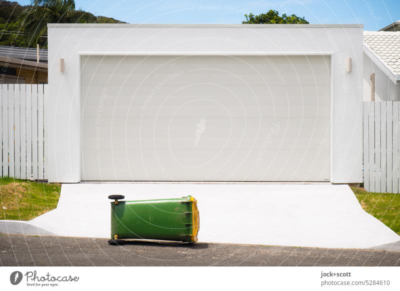 juxtaposition | of rectangular shapes like garage and garbage can Garage Garage door waste bins White Structures and shapes Australia Topple over Closed