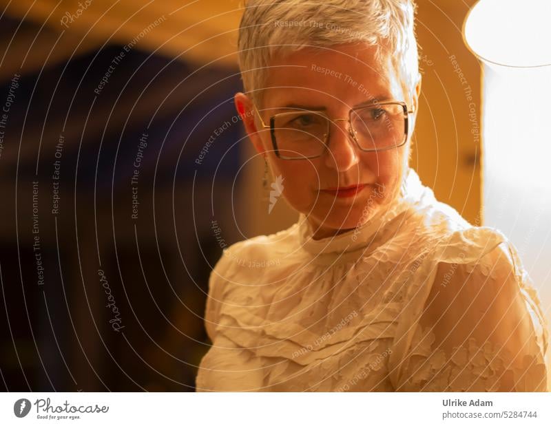 MainFux | Chic woman, thoughtful in atmospheric light Woman Adults pretty Fashion Feminine portrait Human being warm Meditative white blouse Eyeglasses Elegant