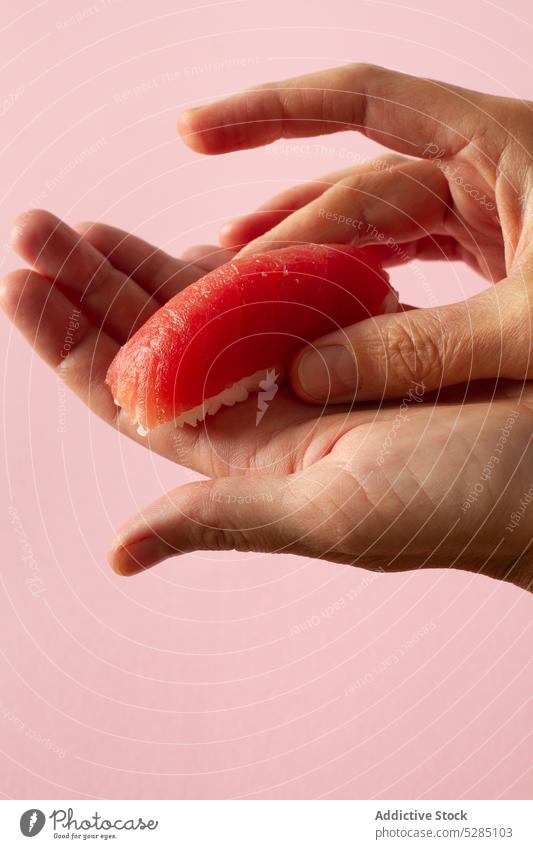 Crop hands making sashimi sushi person prepare cook asian food chopstick cuisine oriental tradition salmon fish handmade kitchen culture recipe product