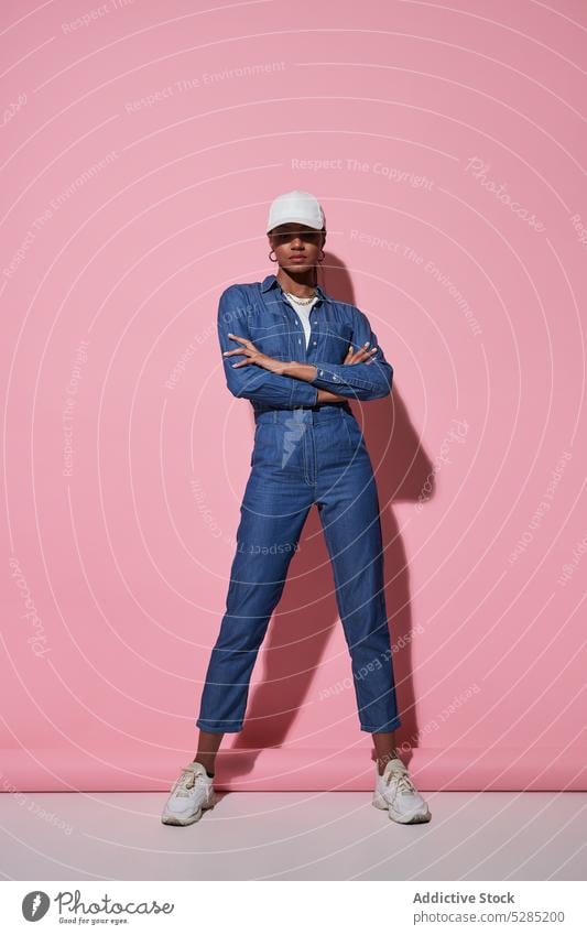 Stylish black woman in white cap in studio style denim fashion trendy outfit model apparel appearance jeans female ethnic young african american confident