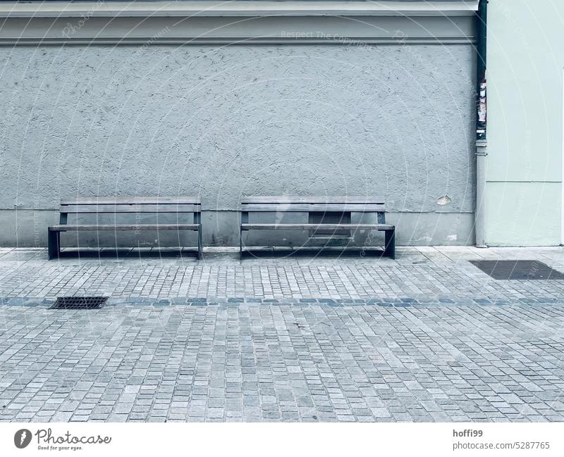 two empty benches in front of drab facade dreariness void Loneliness Distress sad Gloomy Sadness Gray Bench Day Emotions Minimalistic Grief Cold Moody Earnest