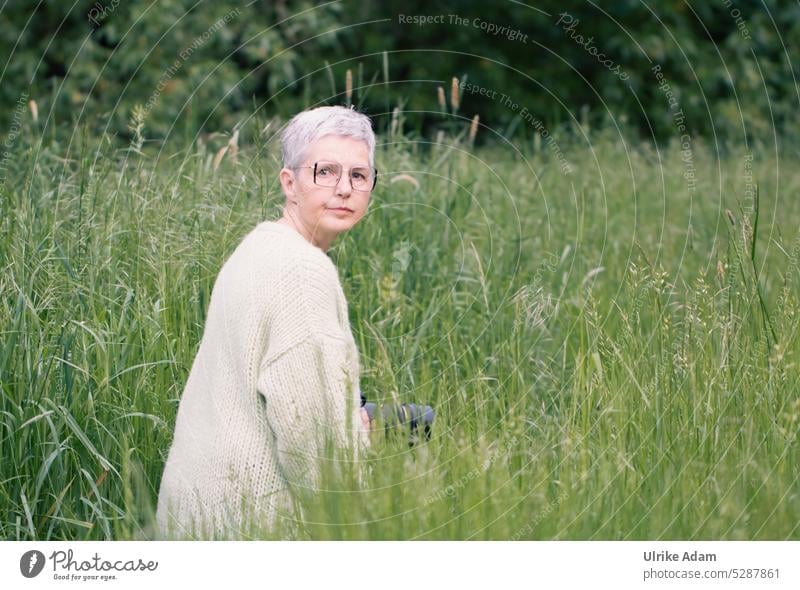 Mainfux| Where is the dewdrop? - Woman kneels and looks for dewdrop in the meadow in the early morning naturally Authentic Human being Adults Feminine