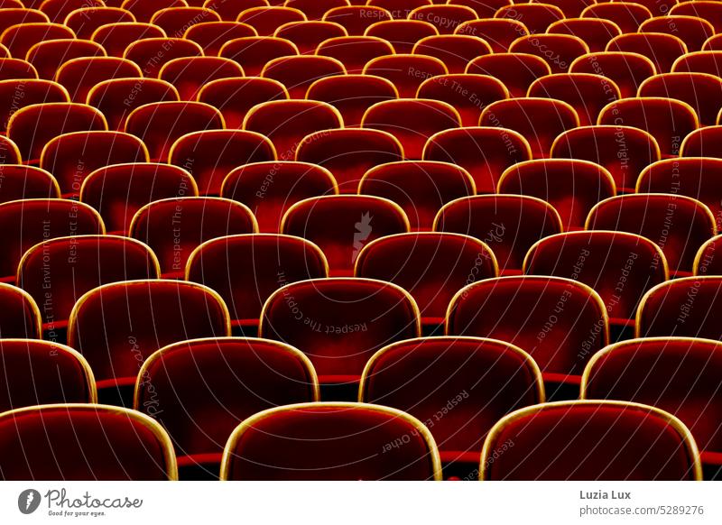 Auditorium with bright red armchairs spectator ranks Theatre Armchair Seat Empty Seating Chair Deserted Free Places Seating capacity Row of chairs Row of seats