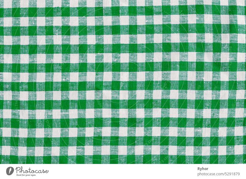Natural Plaid Fabric Abstract Background Texture, Green White Colors. checkered tablecloth fabric. green with white tartan square pattern as background. Linen Plaid Fabric Tablecloth. Abstract Background, Green And White Colors tartan square pattern.