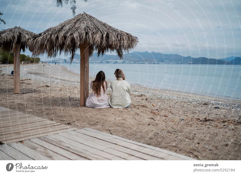Two people sitting on the beach Beach vacation Vacation & Travel Summer Ocean Summer vacation Tourism Relaxation Water Deserted women Greece Mediterranean sea