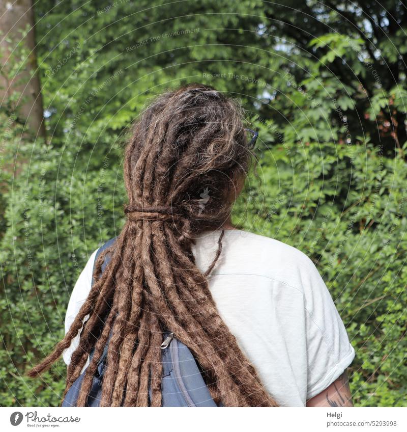 Mainfux-UT | back view of woman with dreadlocks Human being Woman hairstyle Long-haired Rear view Brunette Park Tree shrub leaves Backpack Hair and hairstyles