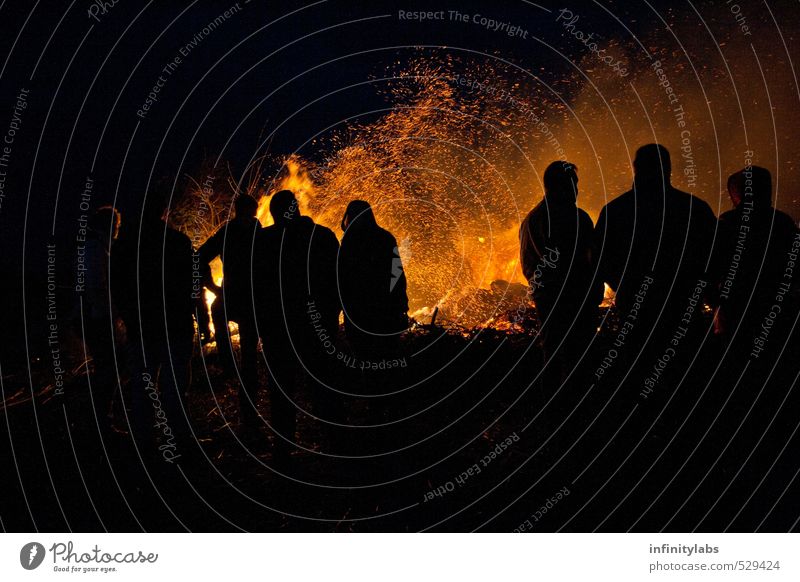 Easter fire Joy Leisure and hobbies Feasts & Celebrations Human being Life Group Crowd of people Historic Blaze Silhouette Night Colour photo Exterior shot