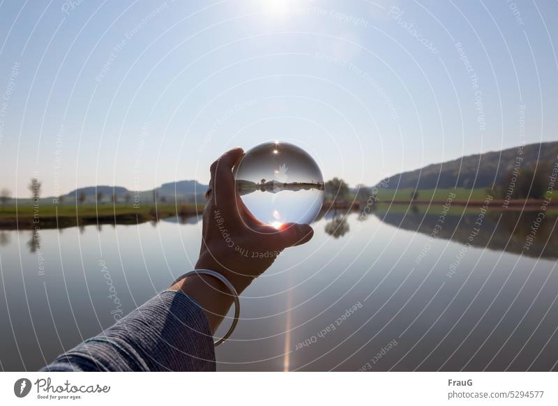 Parallel world | in the glass sphere Landscape Lake mountains trees castle wachsenburg Sky Sun arm Hand Bangle Glass ball Cone of light
