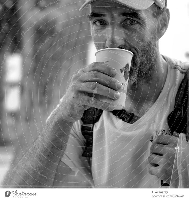 Man sipping from coffee to go cup Only one man Adults portrait Individual One young adult man Young man Exterior shot Day Face of a man 1 Person
