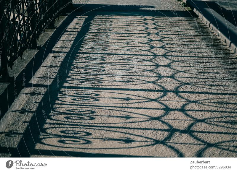 Shadow cast by forged railing on the sidewalk of a bridge Bridge Ornament Pattern off Street Friedrichstraße Sun sunshine Berlin Middle walkway Town
