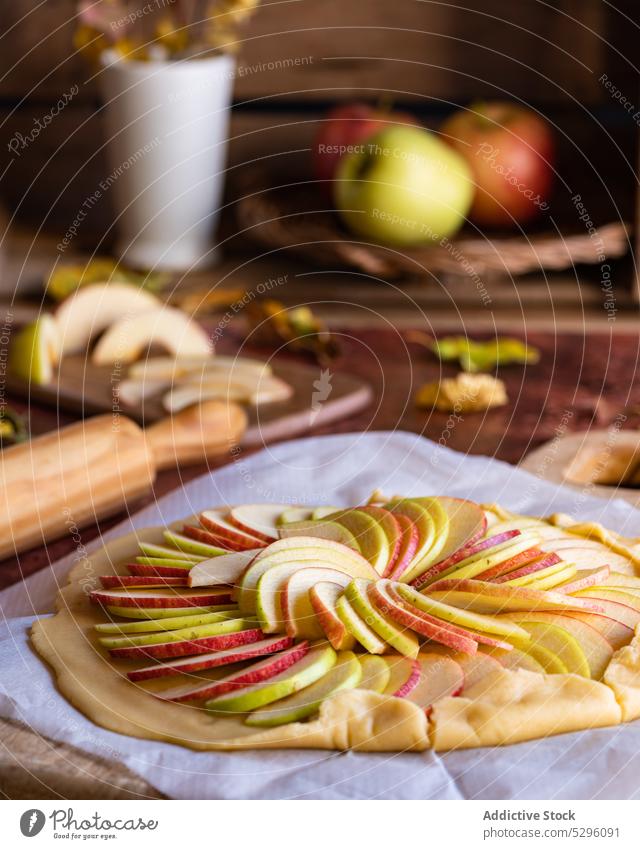Unbaked galette apple pie on baking paper raw dough unbaked homemade prepare slice uncooked pastry shortcrust cuisine at home yummy cookery culinary tasty fresh