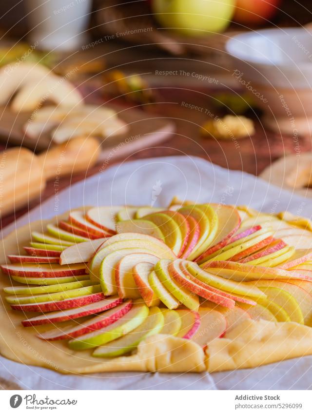 Unbaked galette apple pie on baking paper raw dough unbaked homemade prepare slice uncooked pastry shortcrust cuisine at home yummy cookery culinary tasty fresh