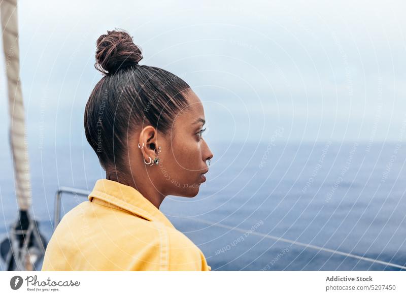 Dreamy black woman admiring seascape yacht admire serious view holiday relax water nature female african american ethnic young calm ripple trip vacation vessel