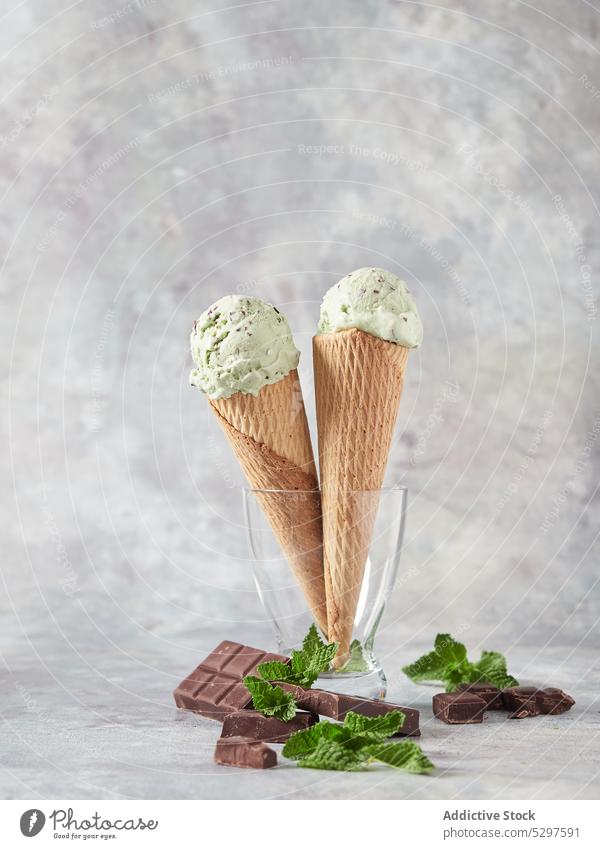 Waffle cones with ice cream in glass vase waffle dessert sweet scoop chocolate mint delicious portion fresh food yummy ball tasty flavor treat leaf gourmet