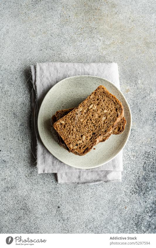 Healthy rye bread slices background bake board concrete diet eat eating food fresh baked healthy keto kitchen meal napkin plate seed stone sunflower seed table
