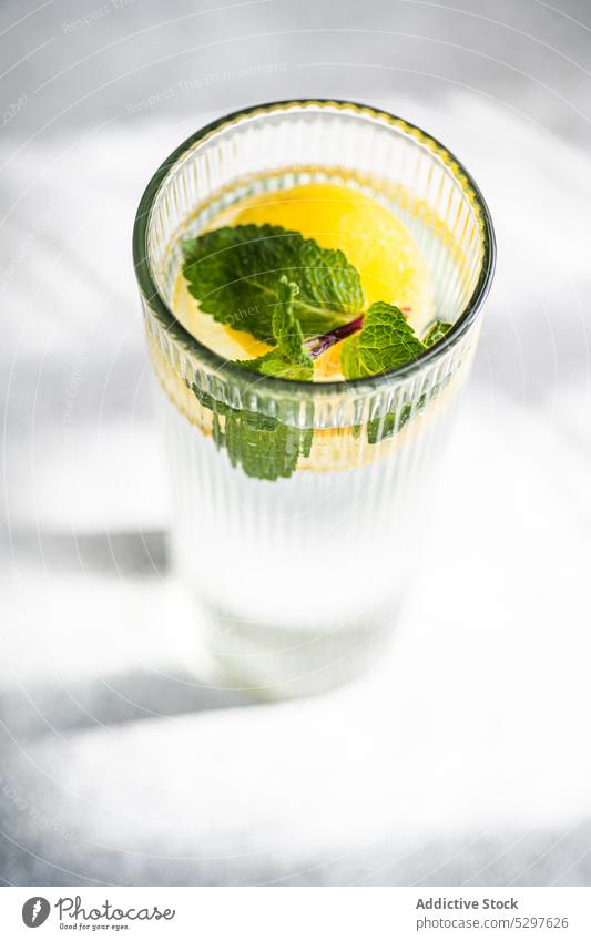 Mojito cocktail with mint and lemon alcohol background beverage citrus cold concrete crystal drink fresh glass green ice leaf leaves menton mojito refreshing