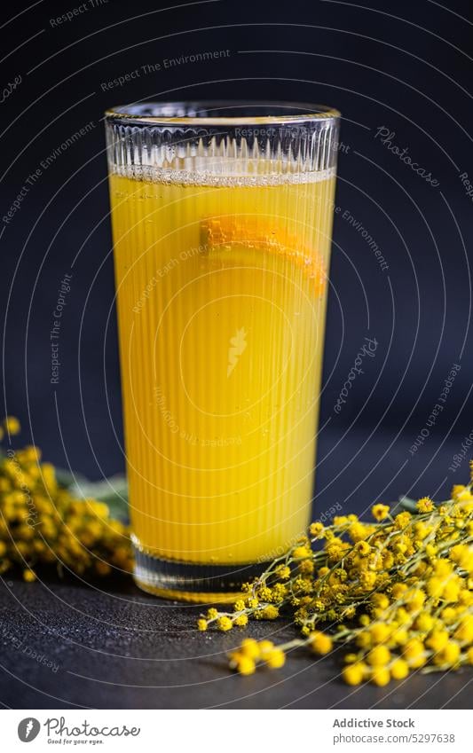 Mimosa cocktail in the glass on black stone table alcohol alcoholic background beverage champagne champagne glass close up concrete crystal dark day drink
