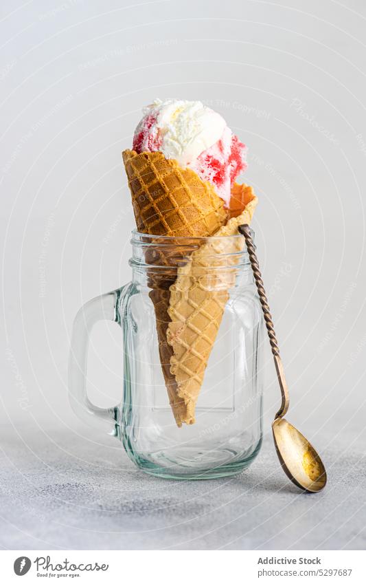 Glass jar with waffle cone filled with cherry ice cream berry cold concrete cup dessert delicacy fruit glass gourmet homemade melt mug transparent glassware