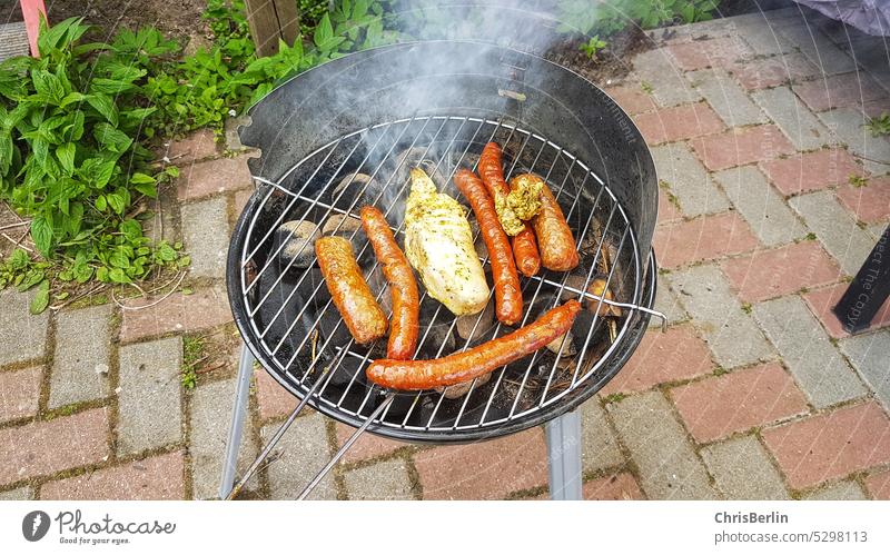 Charcoal grill with sausages charcoal grill Barbecue (apparatus) Grill BBQ season Meat Nutrition Food Small sausage Barbecue Sausages Exterior shot Delicious