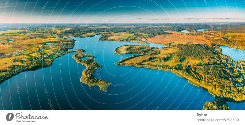 Aerial View Of Nedrava Lake And Green Forest Landscape In Sunny Autumn Morning. Top View Of Beautiful European Nature From High Attitude. Bird's Eye View. Famous Lakes. Natural Landmarks. Small Islands