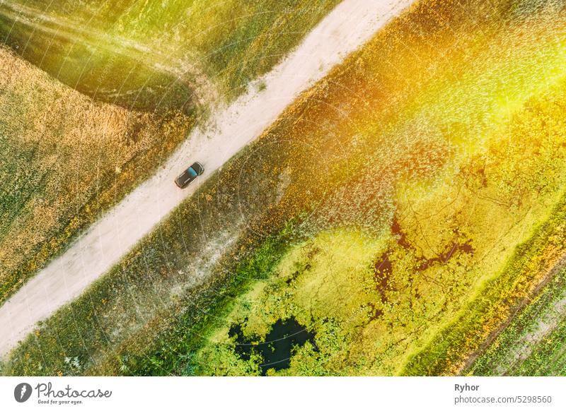 Aerial View Of Car SUV Parked Near Countryside Road, Summer Field Rural Landscape near bog marsh swamp farmland car outdoor automobile park countryside summer
