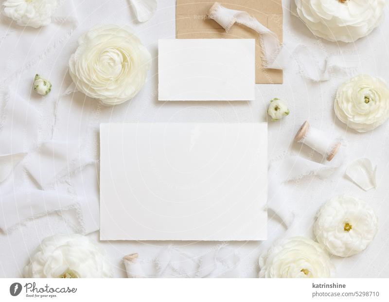 Blank cards near cream roses and white silk ribbons top view, wedding mockup WEDDING flowers romantic horizontal paper valentine spring mothers day above pastel
