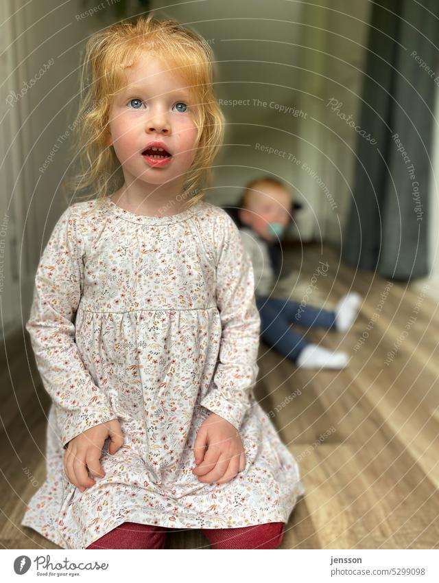 Three years old girl with surprised look Child Infancy Childlike Girl triennial Toddler Human being Cute blurred background floor Colour photo 1 - 3 years Day