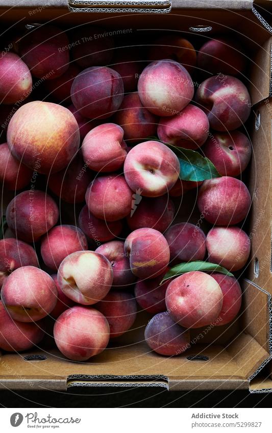 Fresh ripe peaches in carton box fresh heap fruit food organic vitamin natural raw delicious stall healthy container pile nutrition sweet ingredient many bunch