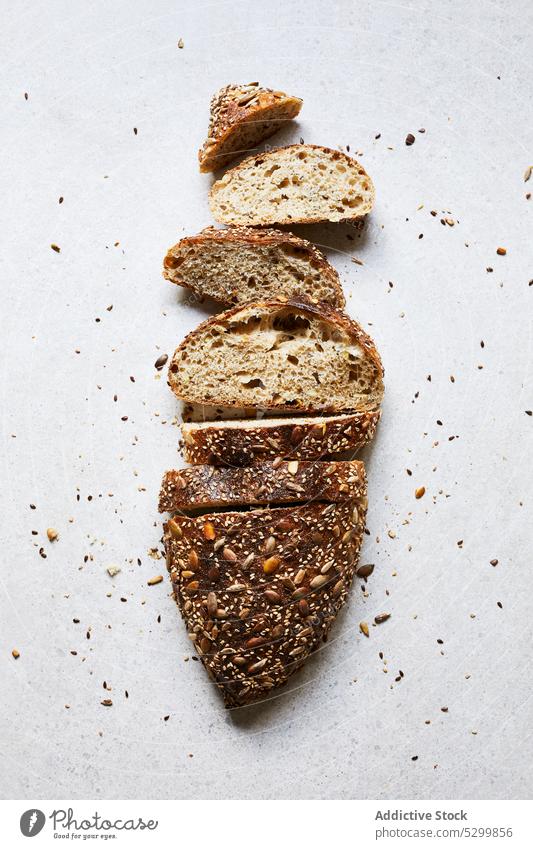 Delicious fresh baked sliced bread seed homemade loaf food cut crispy crust appetizing tasty delicious meal bakery nutrition natural rustic cuisine pastry