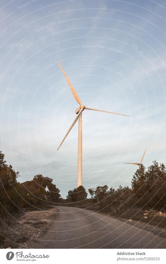 Windmill against cloudless blue sky windmill nature construction exterior power structure environment building industry reusable reclaimable spain daytime