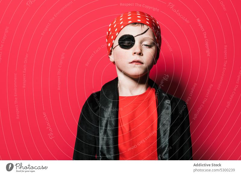 Cute boy in pirate costume kid style uniform confident pretend bright play funny brave child cute male relax vivid eyes closed colorful outfit adorable carnival