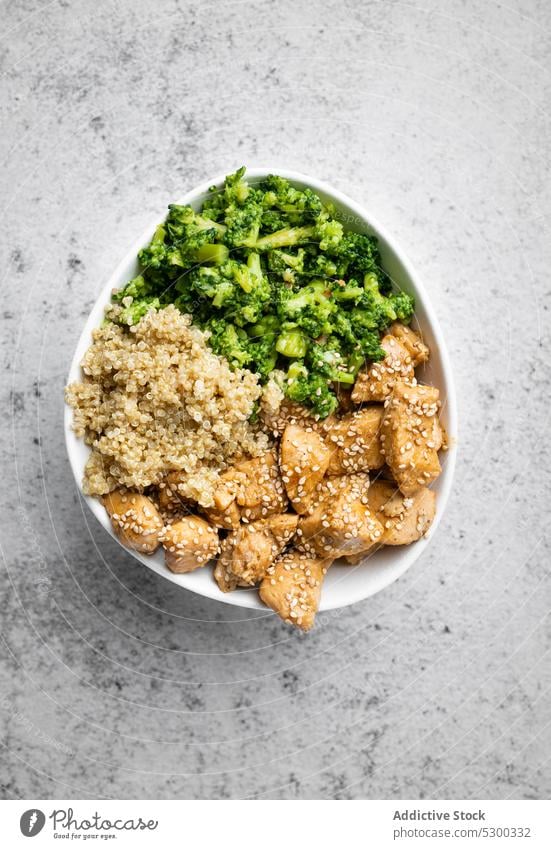 Delicious dish with fried chicken and green vegetable broccoli quinoa bowl appetizing tasty meal serve nutrition food cuisine lunch cook delicious dinner yummy