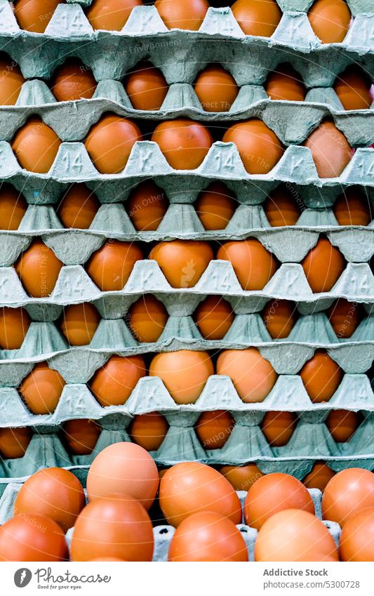 Eggs on rack in local market for sale egg chicken raw tray food fresh product pile nutrition organic stall bazaar retail sell protein background many trade