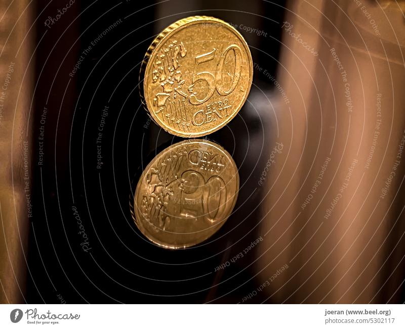 50 cent piece on mirror surface 50 cents Euro Money Discount Loose change Coin Cent Coins euro cents Eurocent pieces