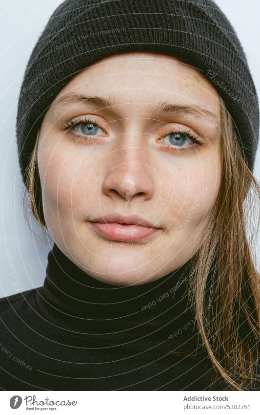Calm woman in black turtleneck and beanie hat portrait model style natural female young appearance trendy fashion individuality charming accessory demonstrate