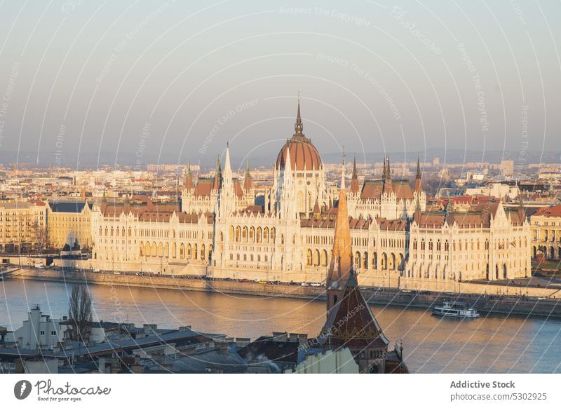 Old city with classic buildings and royal castle river dome palace architecture cityscape evening arched old historic shore hungarian parliament building