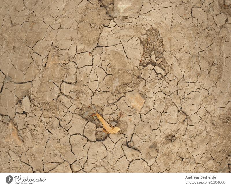 Dried soil texture, cracked sand backdrop, global warming dried hard waterless geology environmental above textured dirty erosion detail rain heat clay arid