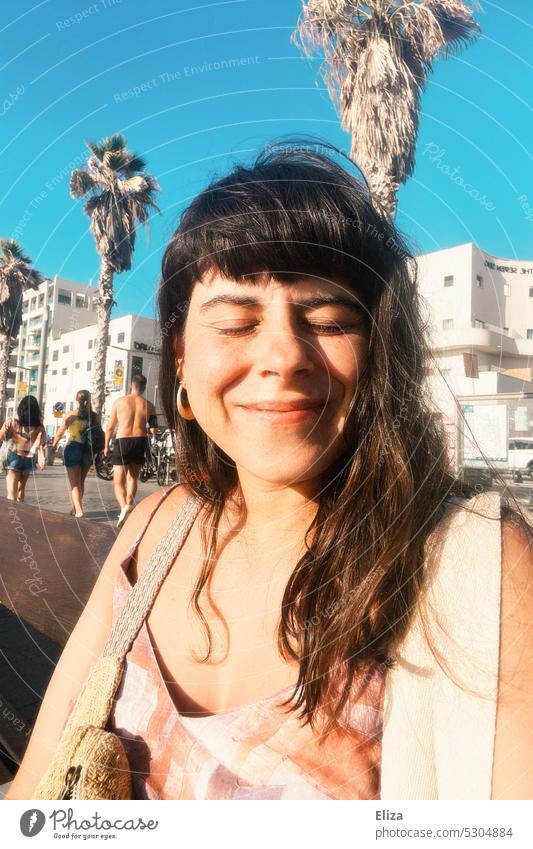 Woman smiling contentedly and relaxed with closed eyes and sun on her face. Vacation mood. vacation Summer Sun Vacation & Travel Contentment Closed eyes Smiling