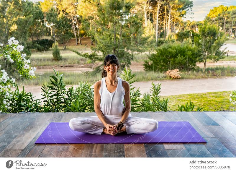Calm woman meditating in yoga pose against plants namaste meditate calm practice nature virasana zen mindfulness spirit wellness pinamar buenos aires argentina