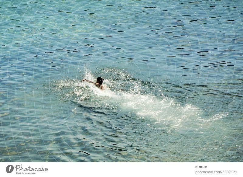 Person swimming away in blue sea Water Ocean be afloat Stroke splash around Movement cooling summer fun Blog Swimming & Bathing bathe Vacation & Travel Waves