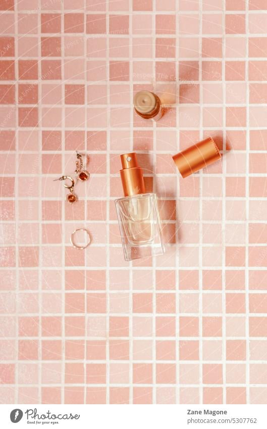 Various personal beauty items on pastel checkered background flatlay checker background flat lay self-care travel items minimalist self-care accessories girl