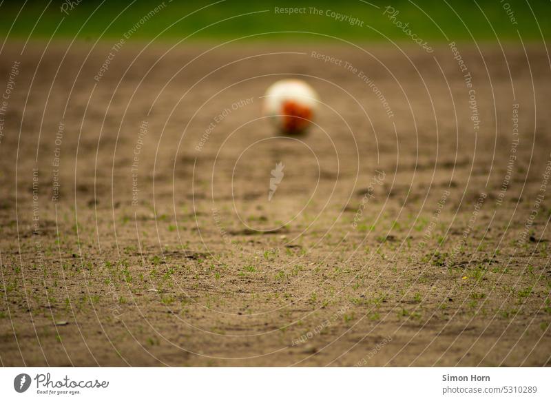 Football field with ball amateur football field Ball Foot ball Depth of field Playing Sports Football pitch Leisure and hobbies forsake sb./sth. Allegory